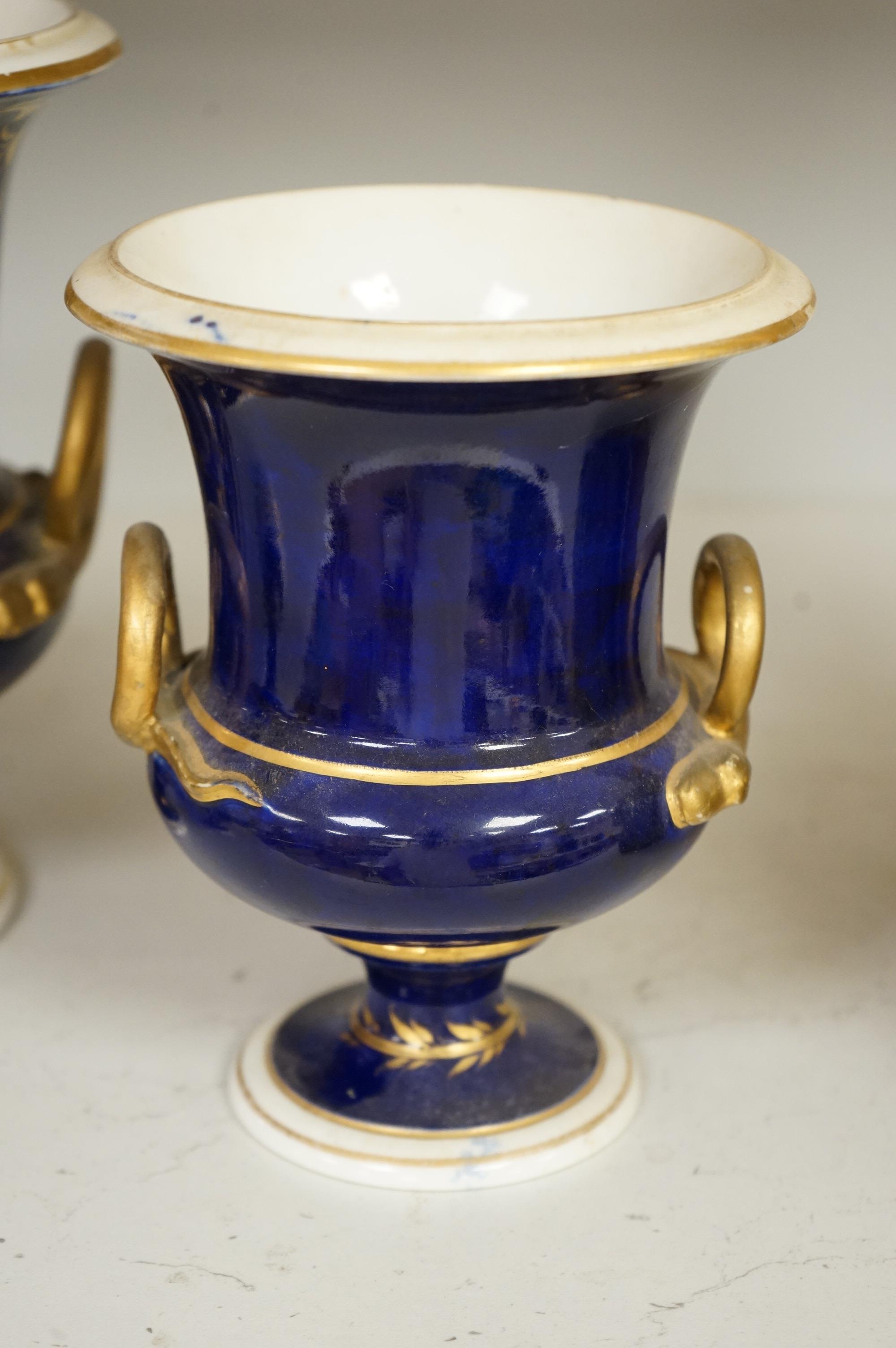A set of three Derby campana vases, painted with named views, circa 1820, tallest 20.5cm
